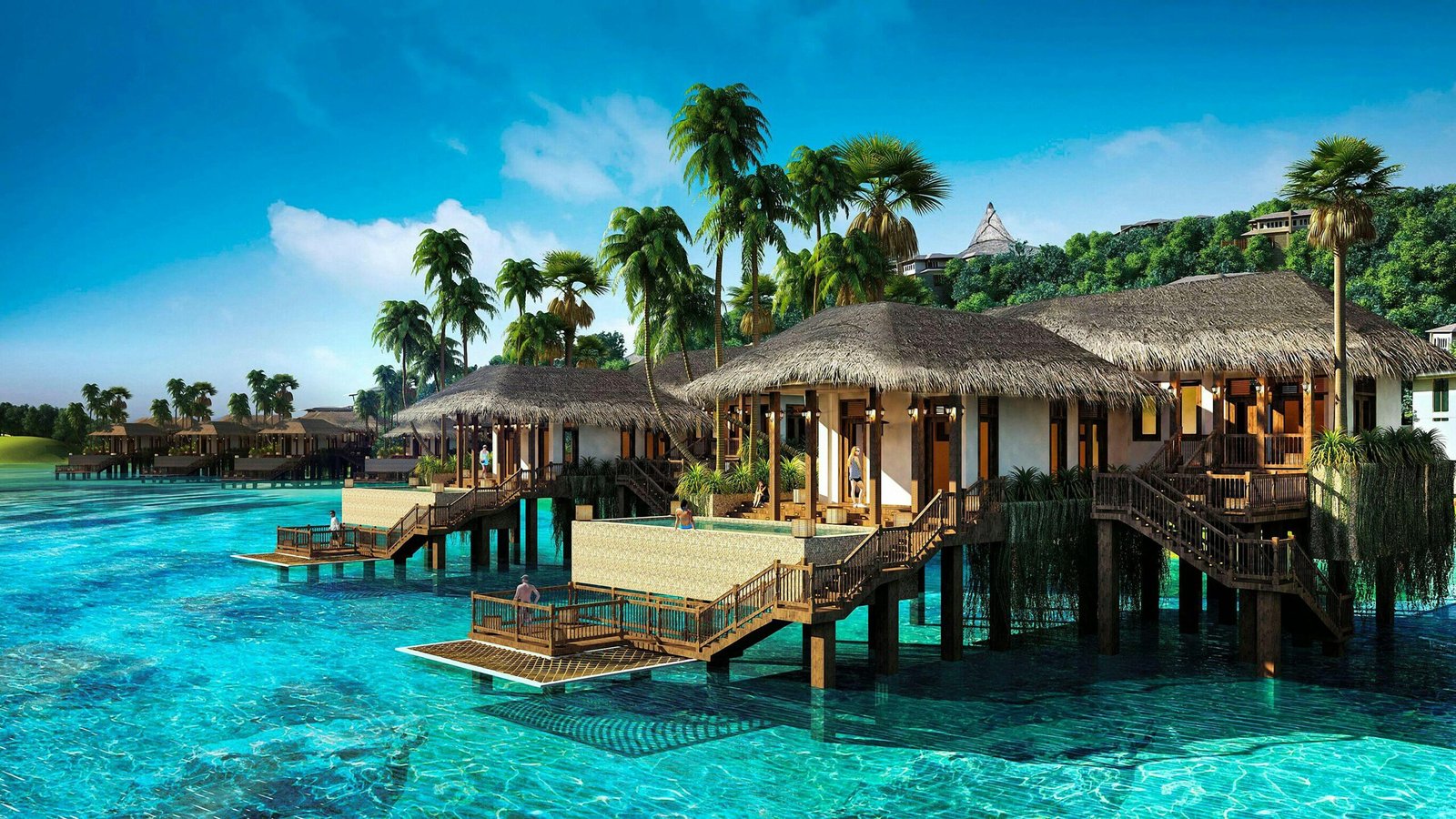 Scenic view of tropical overwater villas surrounded by clear blue water and palm trees in Vietnam.